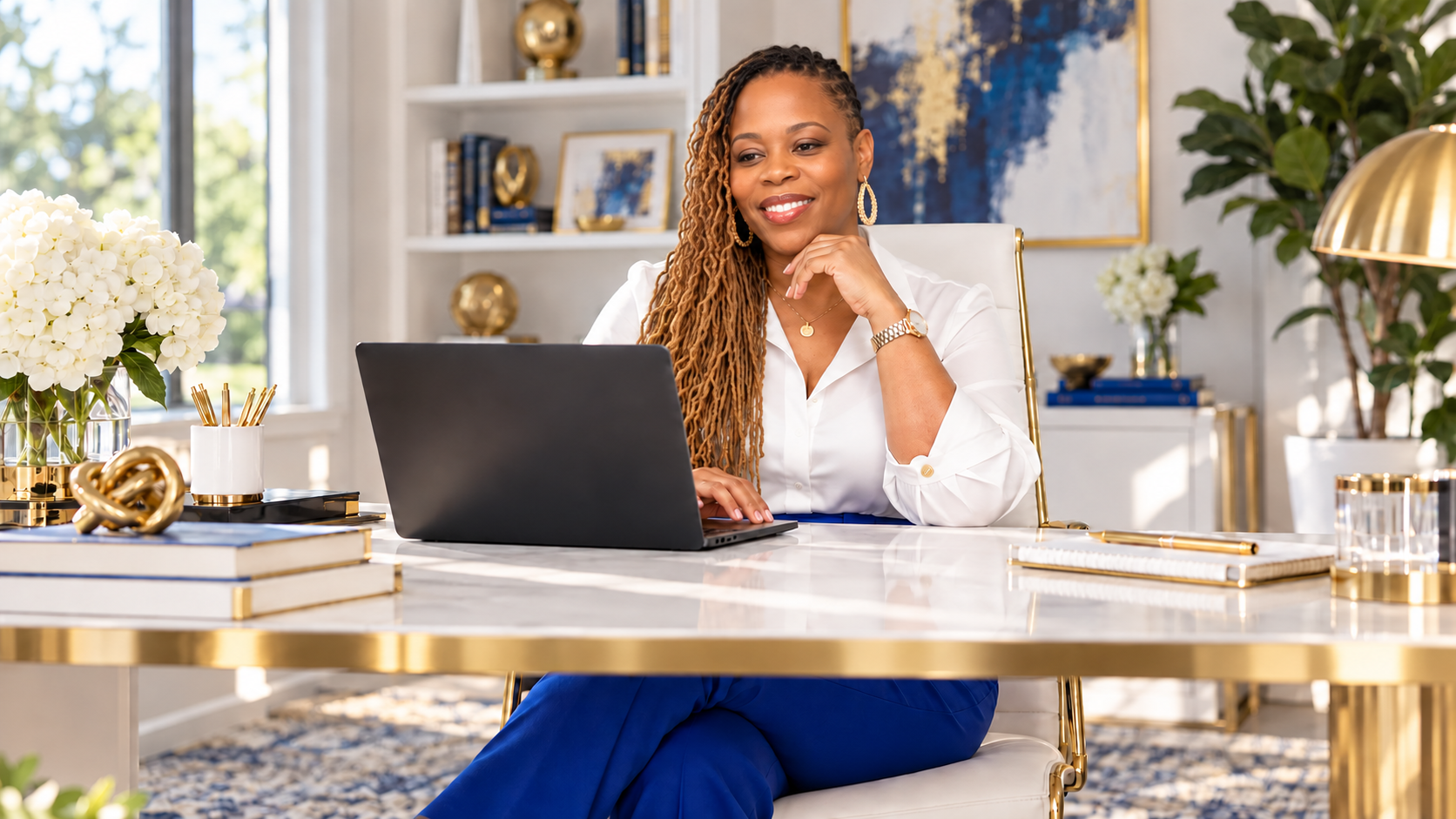 Erika McMillon consulting from an elegant royal blue, white and gold office